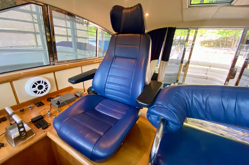 Slide: The Image of Luxurious blue captain's chair in 1999 Neptunus 54 Hardtop Express yacht cockpit. - 37