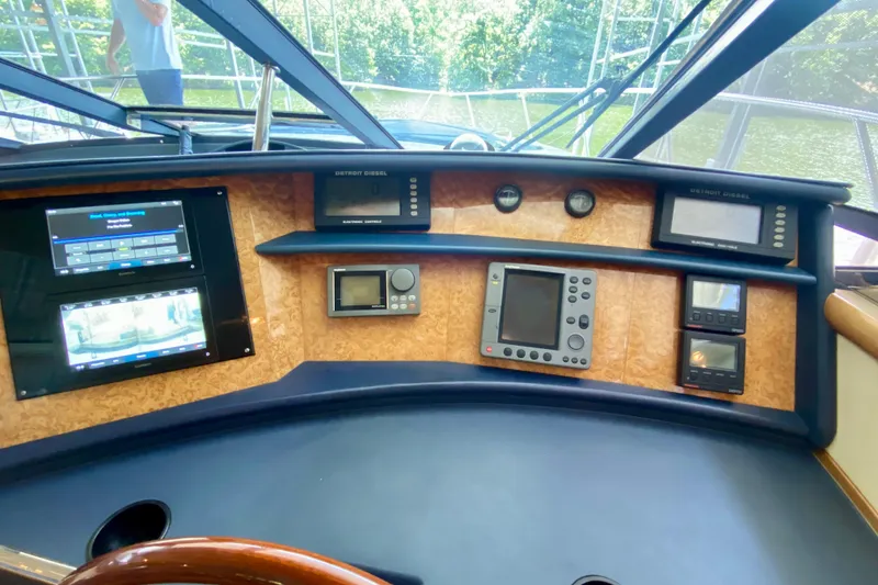 Slide: The Image of Control panel of 1999 Neptunus 54 Hardtop Express yacht with navigation instruments. - 39