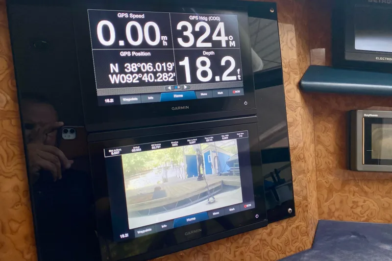 Slide: The Image of Control panel of a 1999 Neptunus 54 Hardtop Express yacht with GPS display. - 40