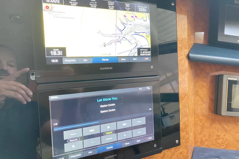 Slide: The Image of Garmin navigation and media display on 1999 Neptunus 54 Hardtop Express yacht. - 41