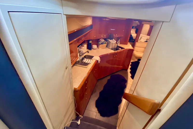 Slide: The Image of Interior view of 1999 Neptunus 54 Hardtop Express yacht kitchen area. - 42