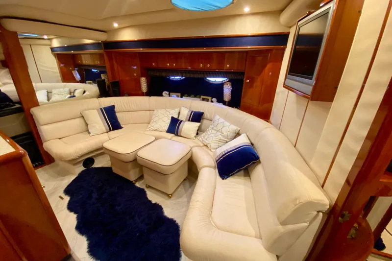 Slide: The Image of Luxurious interior of 1999 Neptunus 54 Hardtop Express yacht with plush seating and elegant decor. - 44