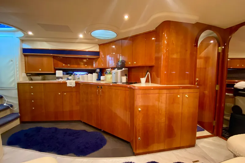 Slide: The Image of Luxurious wooden interior of 1999 Neptunus 54 Hardtop Express yacht kitchen area. - 45