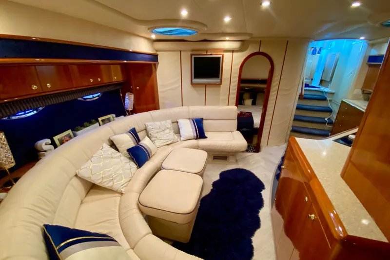 Slide: The Image of Luxurious interior of 1999 Neptunus 54 Hardtop Express yacht with plush seating and elegant decor. - 48