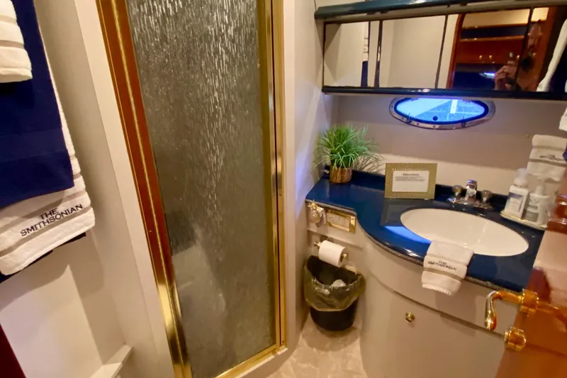 Slide: The Image of Luxurious bathroom in 1999 Neptunus 54 Hardtop Express yacht with shower and sink. - 53