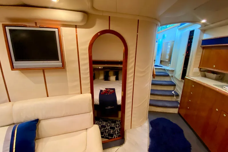 Slide: The Image of Interior of 1999 Neptunus 54 Hardtop Express yacht with cozy cabin and modern amenities. - 56