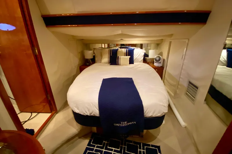 Slide: The Image of Luxurious cabin interior of 1999 Neptunus 54 Hardtop Express yacht with cozy bedding. - 57