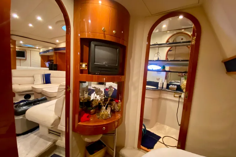 Slide: The Image of Luxurious interior of 1999 Neptunus 54 Hardtop Express yacht with elegant furnishings. - 58