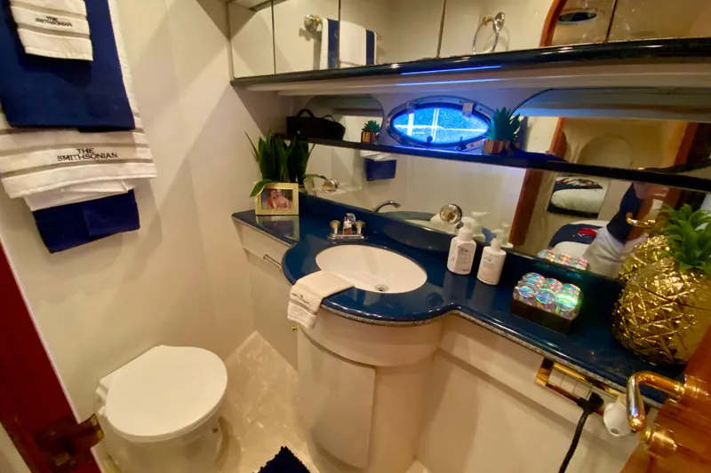 Slide: The Image of Luxurious bathroom in 1999 Neptunus 54 Hardtop Express yacht with elegant decor and amenities. - 60