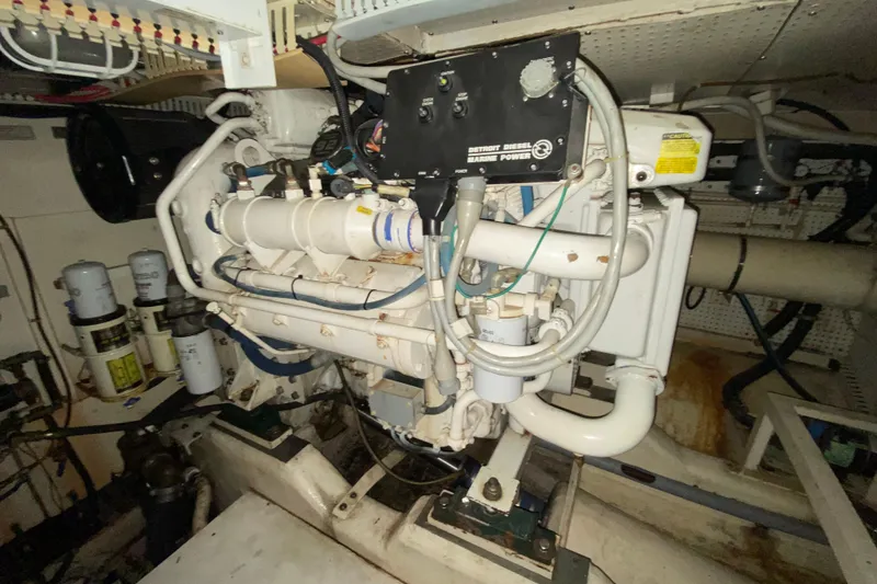 Slide: The Image of Engine room of 1999 Neptunus 54 Hardtop Express yacht, featuring Detroit Diesel Marine Power. - 71