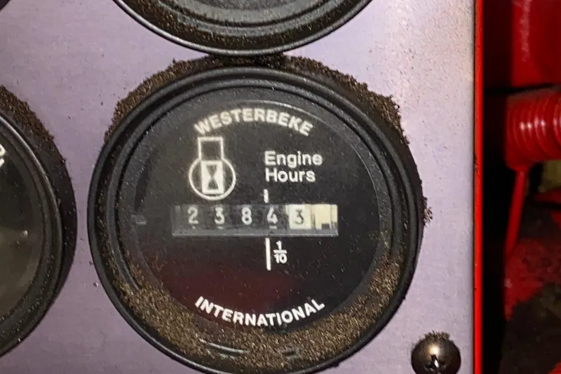 Slide: The Image of Westerbeke engine hour meter showing 2384.3 hours on a 1999 Neptunus 54 Hardtop Express. - 72