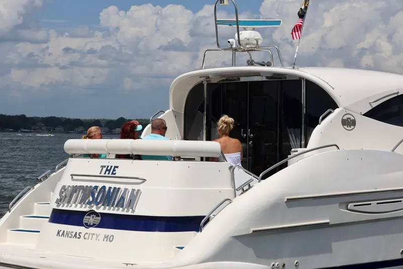 Slide: The Image of 1999 Neptunus 54 Hardtop Express yacht with people on deck, Kansas City, MO. - 9