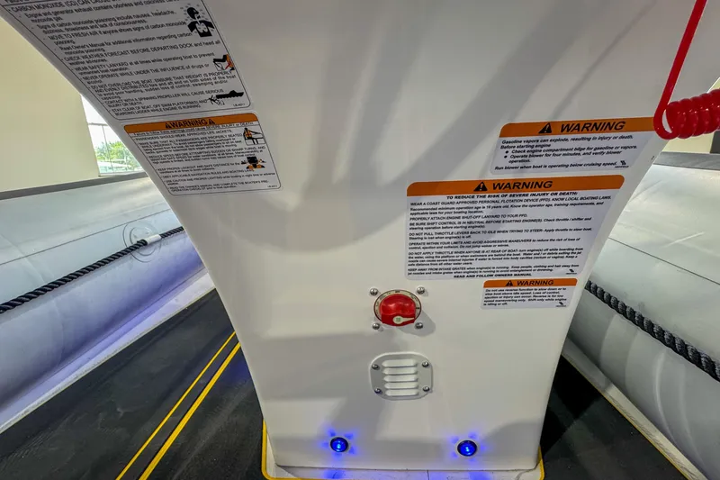 Slide: The Image of Highfield Velox 420 boat interior with safety warnings and controls, 2025 model. - 10