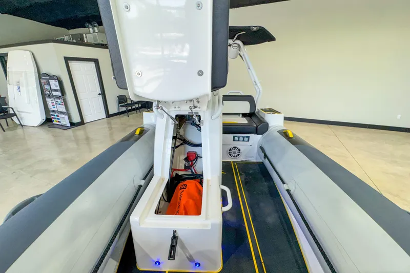 Slide: The Image of 2025 Highfield Velox 420 boat interior with storage compartment open in showroom. - 12