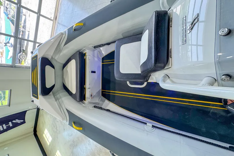 Slide: The Image of 2025 Highfield Velox 420 boat interior with sleek seating and modern design. - 2