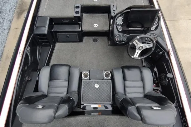 Slide: The Image of 2015 Triton 21 TrX boat interior with dual seats and steering console. - 10