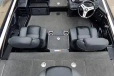 Slide: The Image of 2015 Triton 21 TrX boat interior with dual seats and steering wheel. - 11
