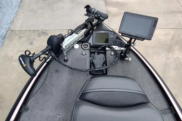 Slide: The Image of 2015 Triton 21 TrX boat cockpit with navigation equipment and controls. - 3