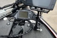 Slide: The Image of 2015 Triton 21 TrX boat dashboard with navigation and control systems. - 4