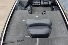 Slide: The Image of 2015 Triton 21 TrX boat interior with seating and storage compartments. - 7