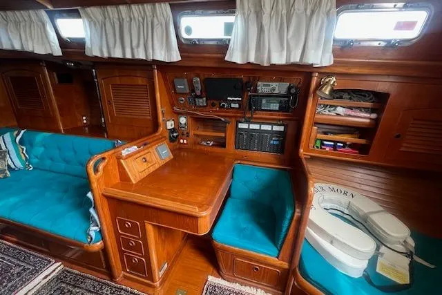 Slide: The Image of 1986 Little Harbor AFt Cockpit K/CB Sloop interior with wood finish and teal seating. - 10