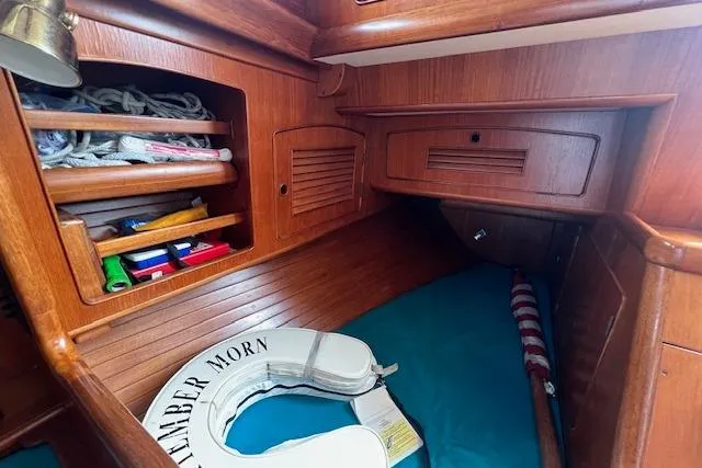 Slide: The Image of 1986 Little Harbor AFt Cockpit K/CB Sloop interior with wooden shelves and life preserver. - 16