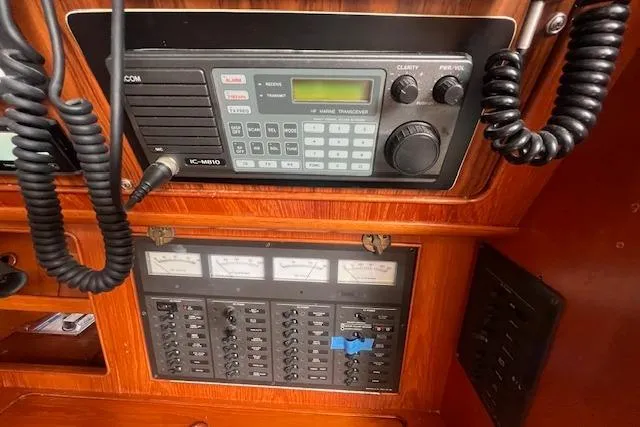 Slide: The Image of 1986 Little Harbor AFt Cockpit K/CB Sloop radio and control panel in wooden interior. - 22