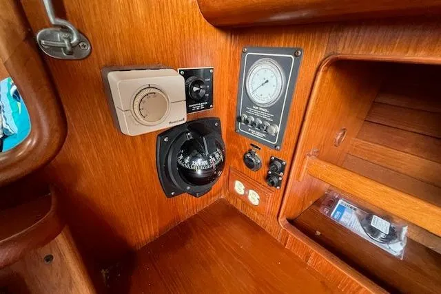 Slide: The Image of 1986 Little Harbor AFt Cockpit K/CB Sloop interior with navigation instruments and wooden finish. - 24