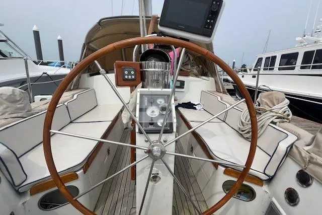Slide: The Image of 1986 Little Harbor AFt Cockpit K/CB Sloop with wooden steering wheel and navigation equipment. - 28