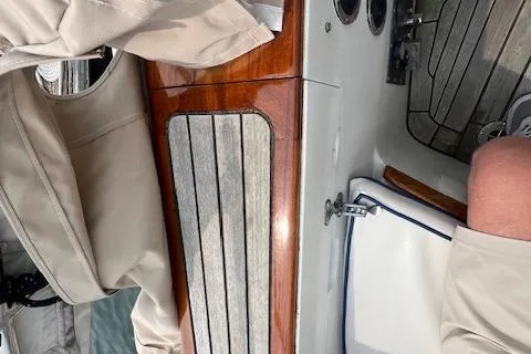Slide: The Image of 1986 Little Harbor AFt Cockpit K/CB Sloop interior with wood and fabric details. - 29
