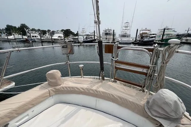 Slide: The Image of 1986 Little Harbor Aft Cockpit K/CB Sloop at marina, showcasing deck and surrounding boats. - 41