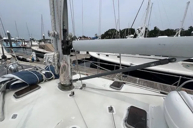 Slide: The Image of 1986 Little Harbor AFt Cockpit K/CB Sloop docked at marina, showing deck and mast details. - 43