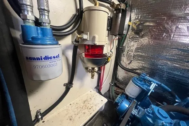 Slide: The Image of Engine room of 1986 Little Harbor AFt Cockpit K/CB Sloop with fuel filter system. - 47