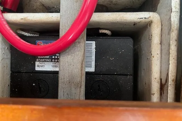 Slide: The Image of Battery compartment of 1986 Little Harbor AFt Cockpit K/CB Sloop with red cable. - 48