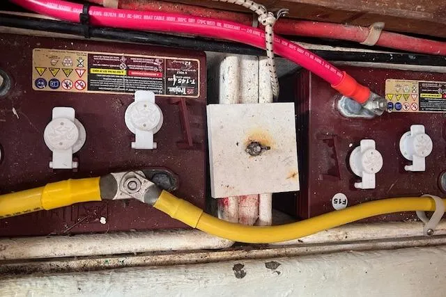 Slide: The Image of Battery compartment of 1986 Little Harbor AFt Cockpit K/CB Sloop with cables and connectors. - 49