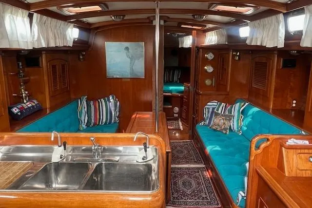 Slide: The Image of Interior of 1986 Little Harbor AFt Cockpit K/CB Sloop with wood finish and teal seating. - 5