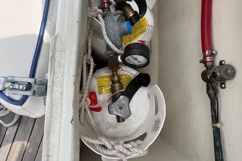 Slide: The Image of Propane tanks and hoses in a 1986 Little Harbor AFt Cockpit K/CB Sloop storage compartment. - 50