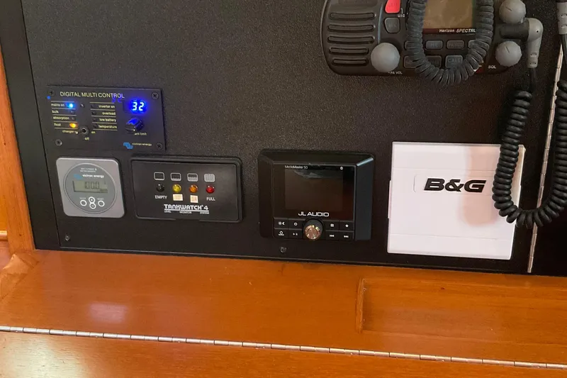Slide: The Image of Control panel of a 2001 Island Packet 420 yacht with various electronic devices. - 26