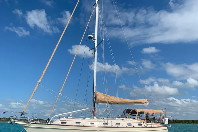 Slide: The Image of 2001 Island Packet 420 sailboat on turquoise water under blue sky. - 38