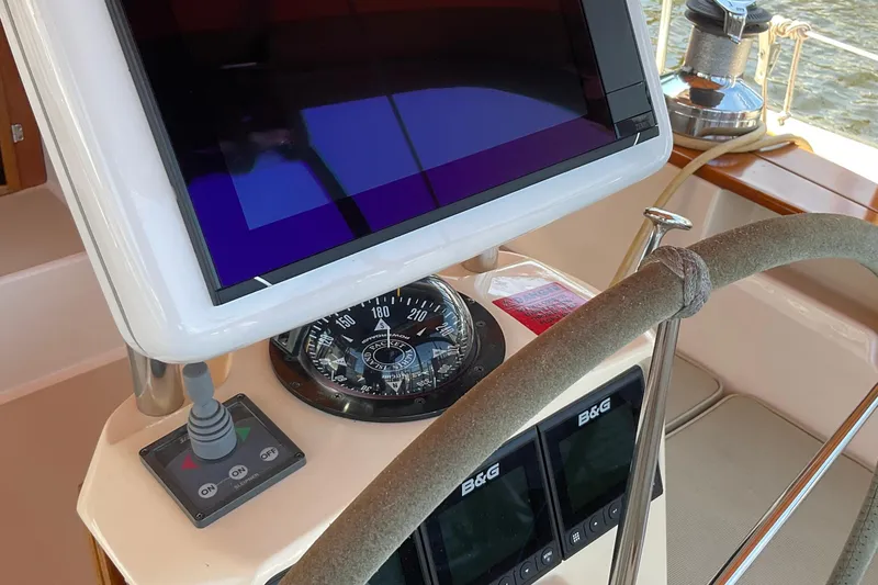 Slide: The Image of Steering console of 2001 Island Packet 420 sailboat with navigation instruments. - 8