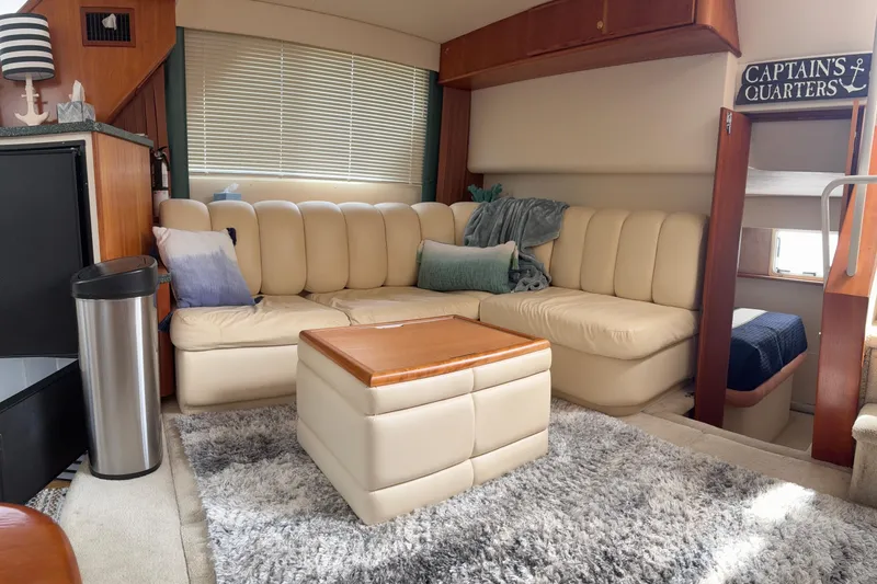 Slide: The Image of Luxurious interior of a 1999 Silverton 392 yacht with plush seating and decor. - 13