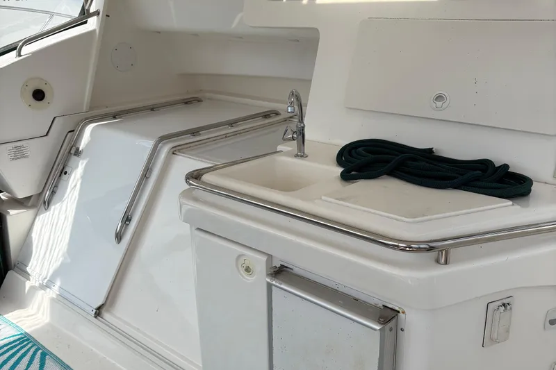 Slide: The Image of Interior of a 1999 Silverton 392 yacht featuring a sink and coiled rope. - 3