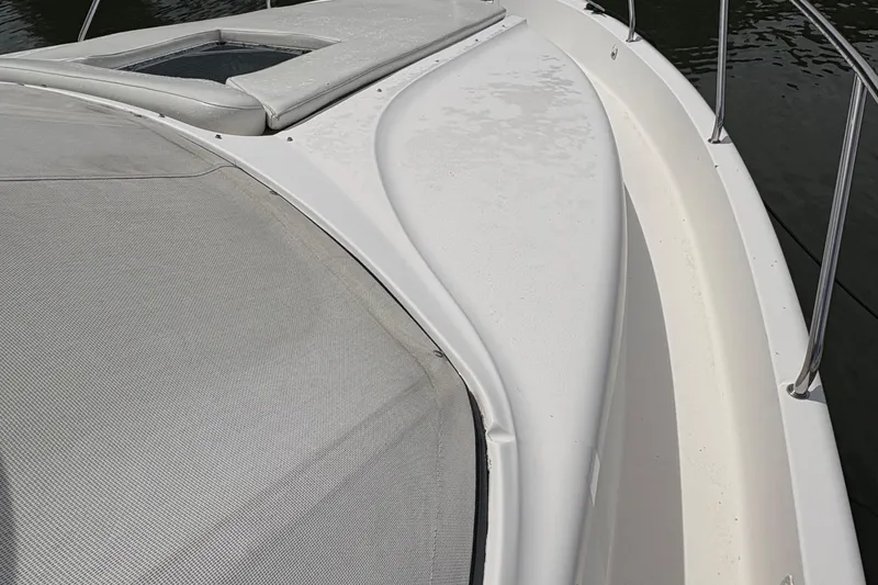 Slide: The Image of 1999 Silverton 392 yacht deck with sleek design and railing, on calm water. - 35