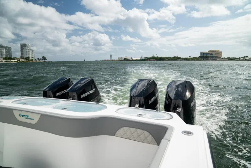 Slide: The Image of 2026 Front Runner 37 Catamaran with Mercury engines cruising on a sunny day. - 6