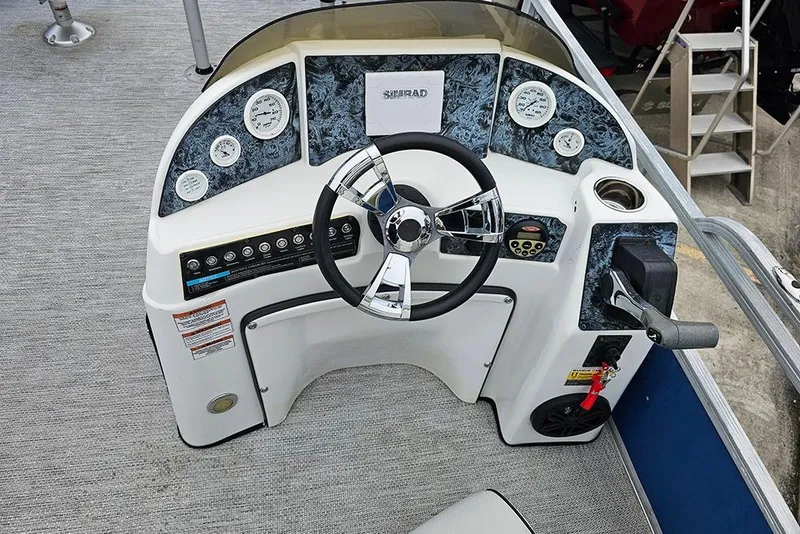 Slide: The Image of 2019 Lexington 321 boat dashboard with steering wheel and control panel. - 11