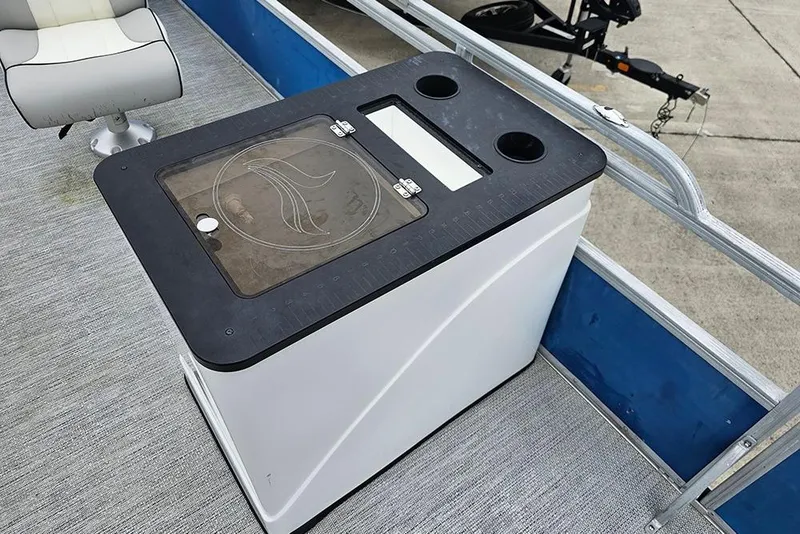 Slide: The Image of 2019 Lexington 321 boat interior with seating and storage unit on deck. - 12