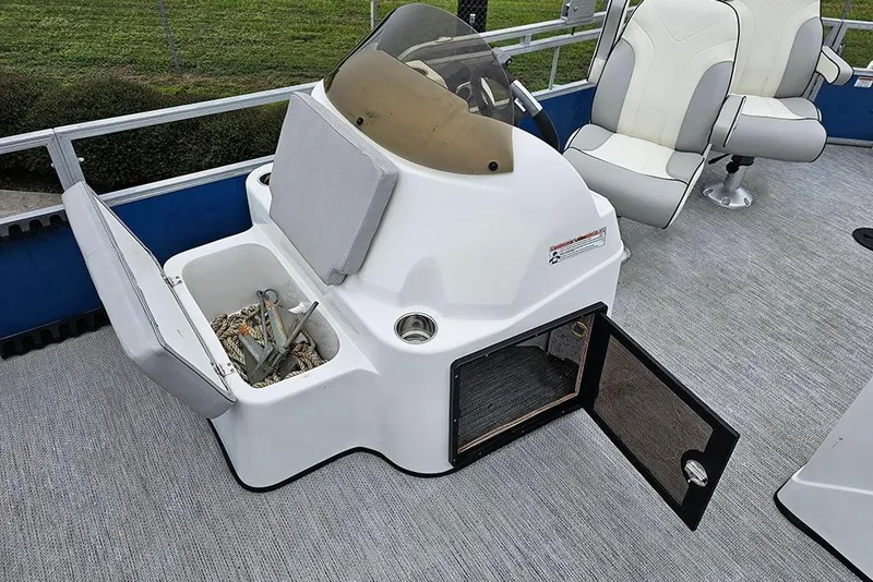 Slide: The Image of 2019 Lexington 321 boat interior with storage compartments and seating. - 15