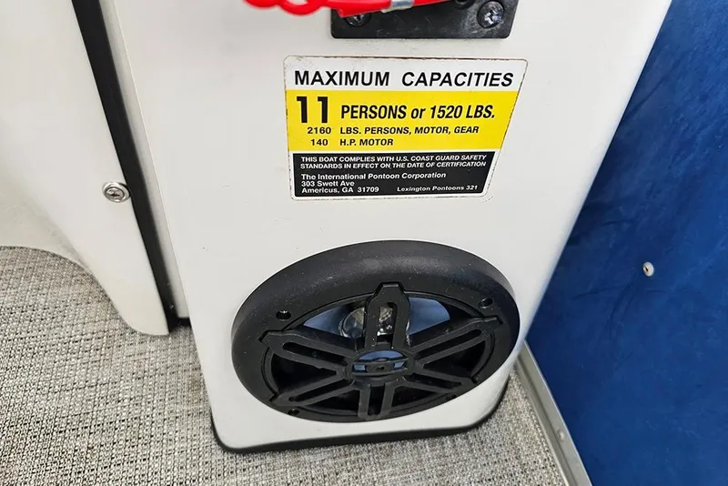 Slide: The Image of 2019 Lexington 321 boat capacity label, 11 persons or 1520 lbs, with speaker below. - 16