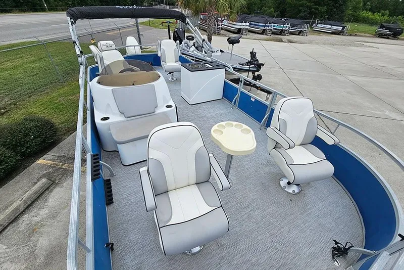 Slide: The Image of 2019 Lexington 321 boat interior with seating and steering console. - 8