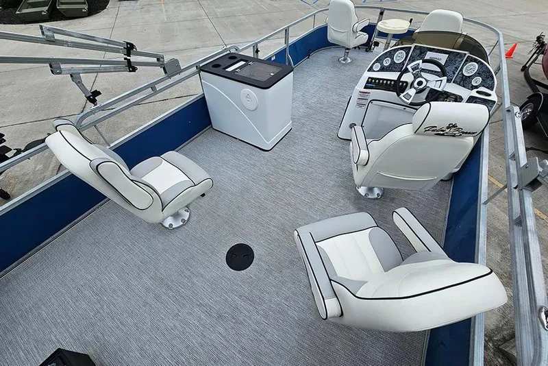 Slide: The Image of 2019 Lexington 321 boat interior with white seating and modern dashboard. - 9